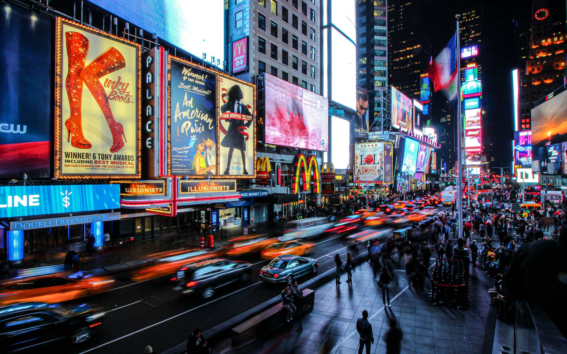 Billboard advertising lighting up a city street